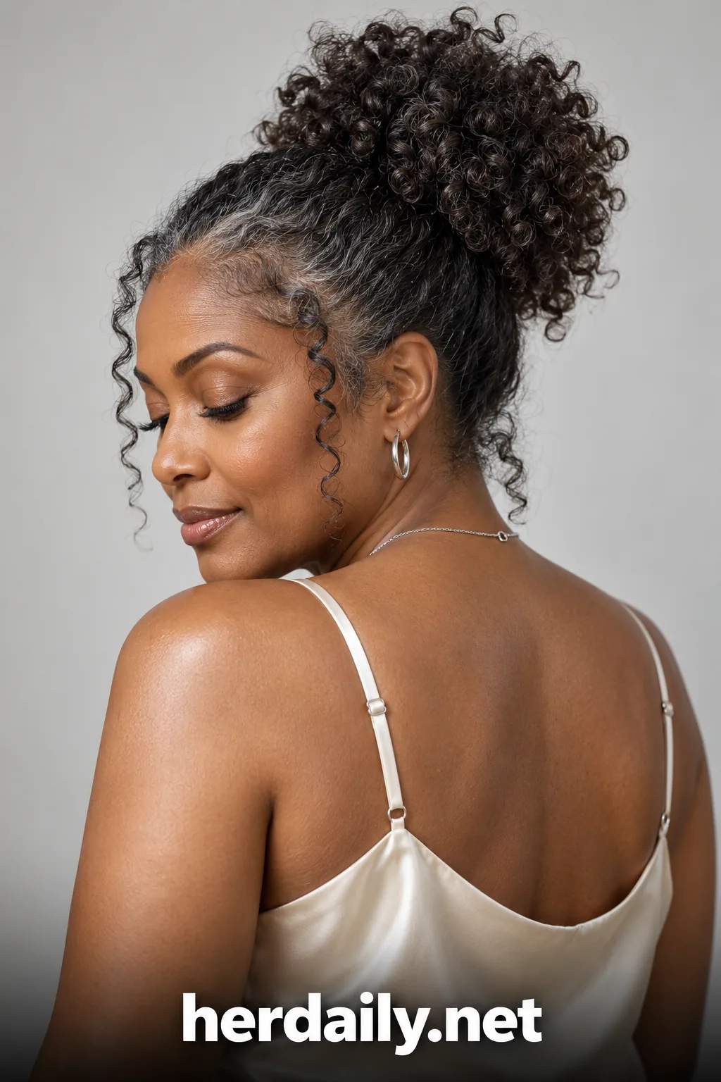 05 black woman silver curly high puff